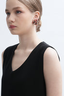A pair of Peach Greta earrings by Aidan & Ice featuring peach-colored hoops with gold accents on a white background.