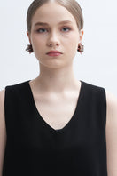 Aidan & Ice Peach Greta earrings with gold-tone hooks and peach-colored bead accents on a white background.