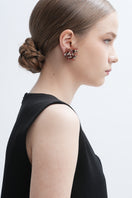 Aidan & Ice Peach Greta earrings featuring peach-colored dangle earrings with gold accents on a white background.