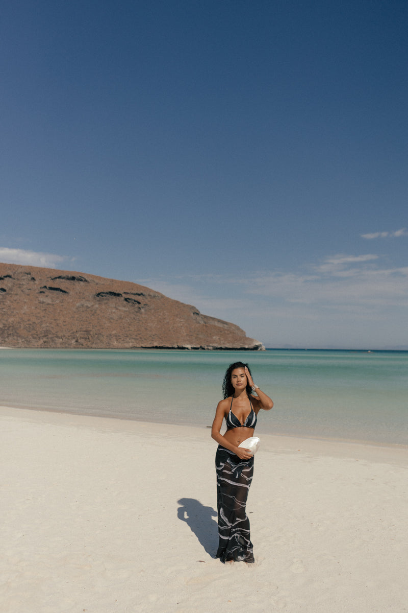 Nelblu Morpho bikini bottom with full coverage, black printed design, showcasing the stylish swimwear fit and fabric details.