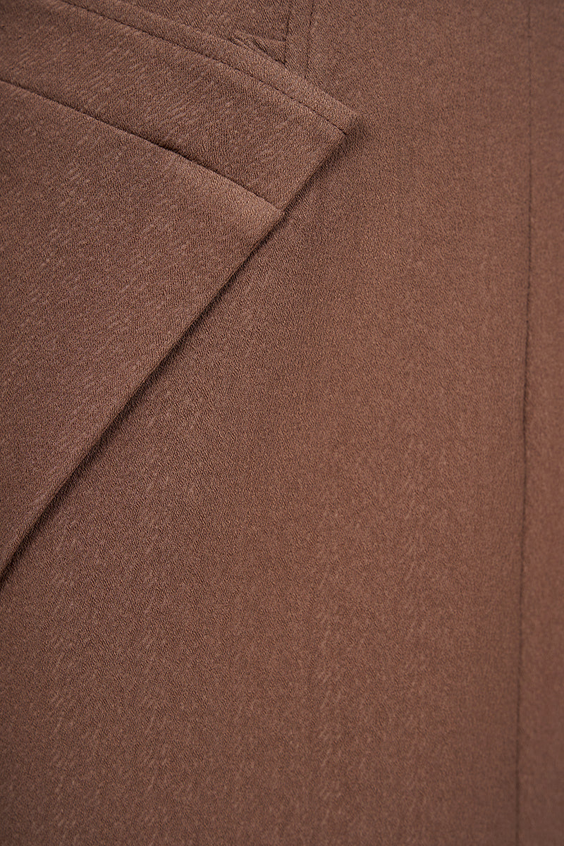 Brown crepe midi skirt by EEGEN STUDIO, featuring a flowy design and stylish waistline, perfect for casual or dressy outfits.