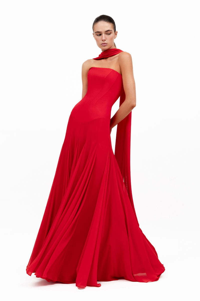 Red Estrella gown by Moon Hakaan Yildirim, showcases elegant fabric and flowing design, perfect for formal occasions.