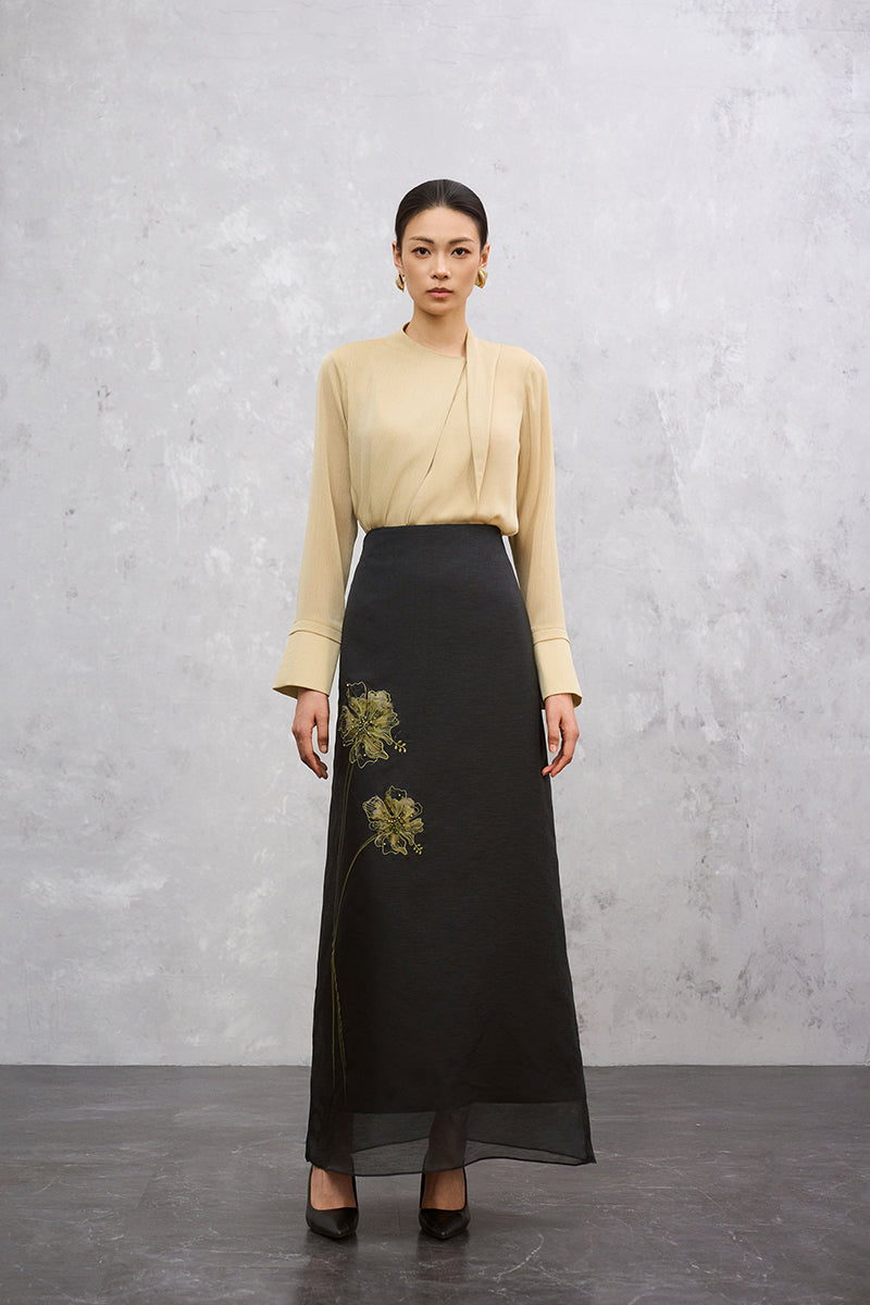 Light yellow long sleeve top from EEGEN STUDIO, featuring a relaxed fit and subtle neckline detail.