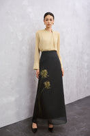 Light yellow long sleeve top from EEGEN STUDIO's NARA collection, shown in the image with black and yellow color options.