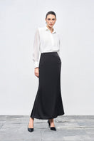 White crinkle chiffon shirt by EEGEN STUDIO with flowy fabric and relaxed fit, shown on a model.