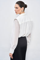 Black silk midi skirt from EEGEN STUDIO, featuring a smooth, flowing fabric and elegant design, perfect for stylish occasions.