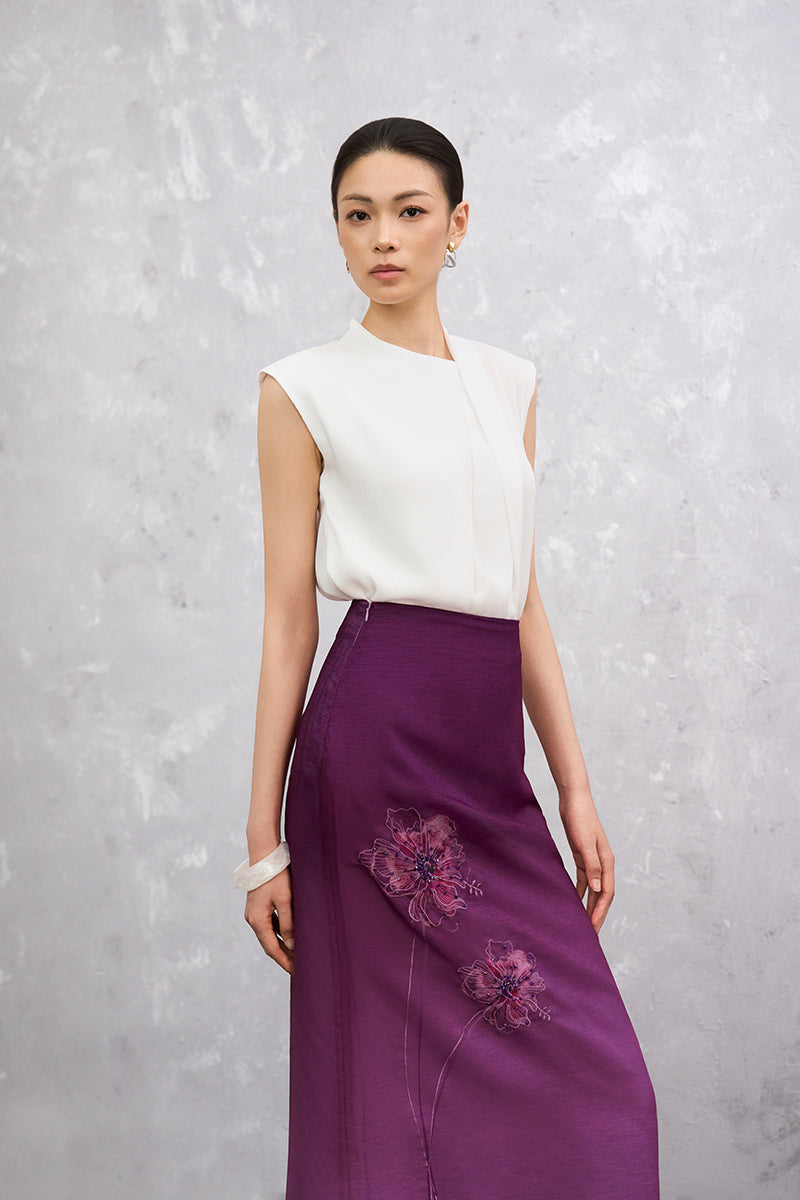 Purple Senna midi skirt from EEGEN STUDIO, shown with a flowy fabric and stylish design, perfect for casual or dressy occasions.
