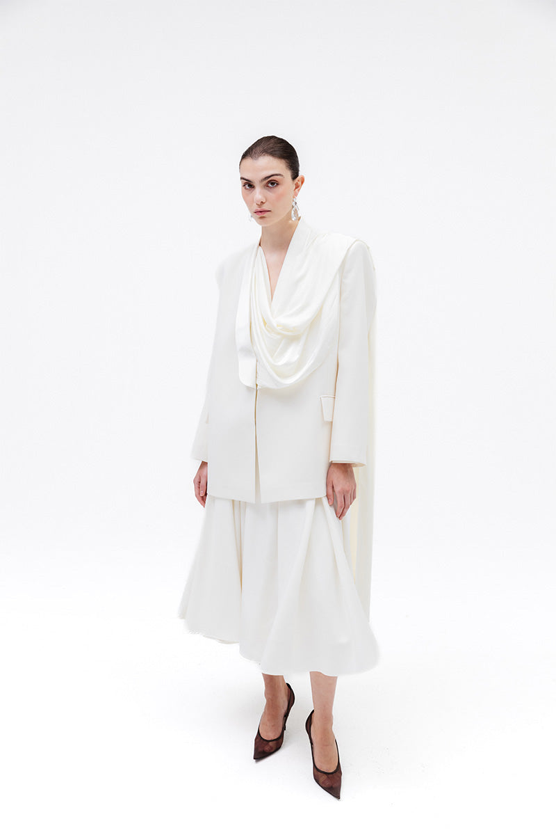 Studio NK ETHERAL blazer in ivory, stylish women's blazer with tailored fit and elegant design, shown on a model.