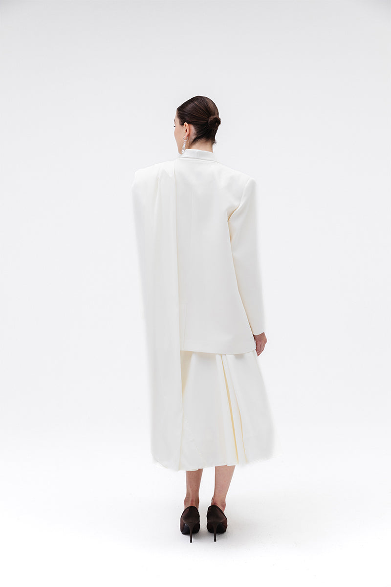 Studio NK ETHERAL Blazer in Ivory, tailored blazer with a sleek fit and elegant design, shown on a model.