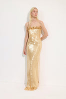 Urban Muse Etoile gown in gold, elegant maxi dress with flowing fabric and intricate detailing, perfect for formal occasions.