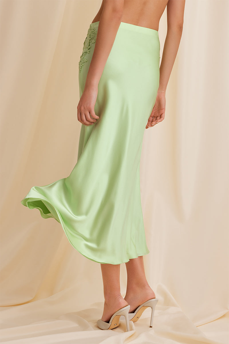Scarlett Gasque Evelyn Midi Skirt in mint color, back view showing flowy fabric and stylish design.
