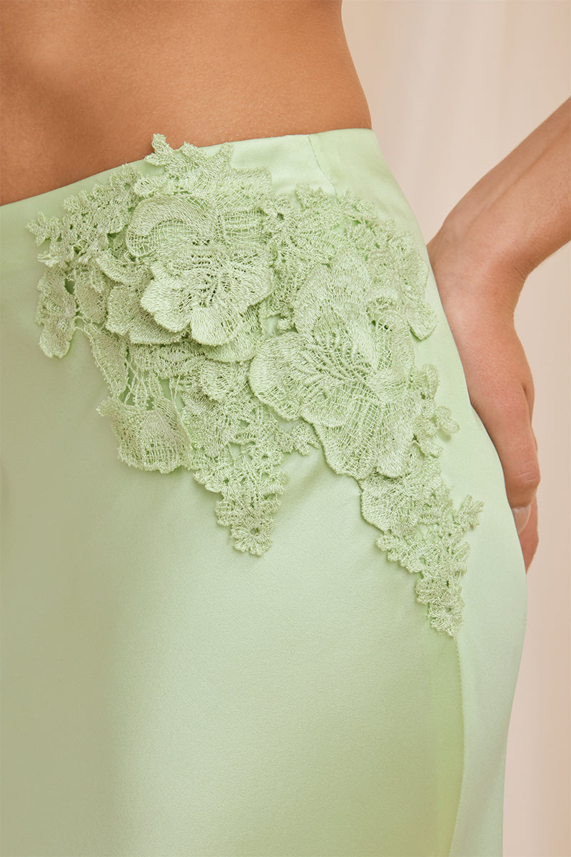 Mint green Scarlett Gasque Evelyn midi skirt with detailed fabric texture and a flowy, elegant silhouette.