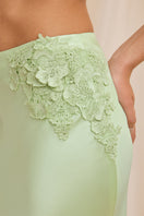 Mint-colored Scarlett Gasque Evelyn Skirt with detailed midi design, showcasing fabric texture and stylish silhouette.