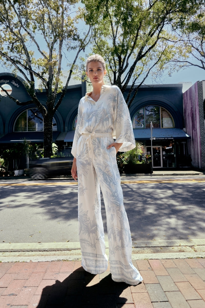 White EZMIR pants by Tinta Latina featuring a stylish printed design, casual fit with comfortable fabric.