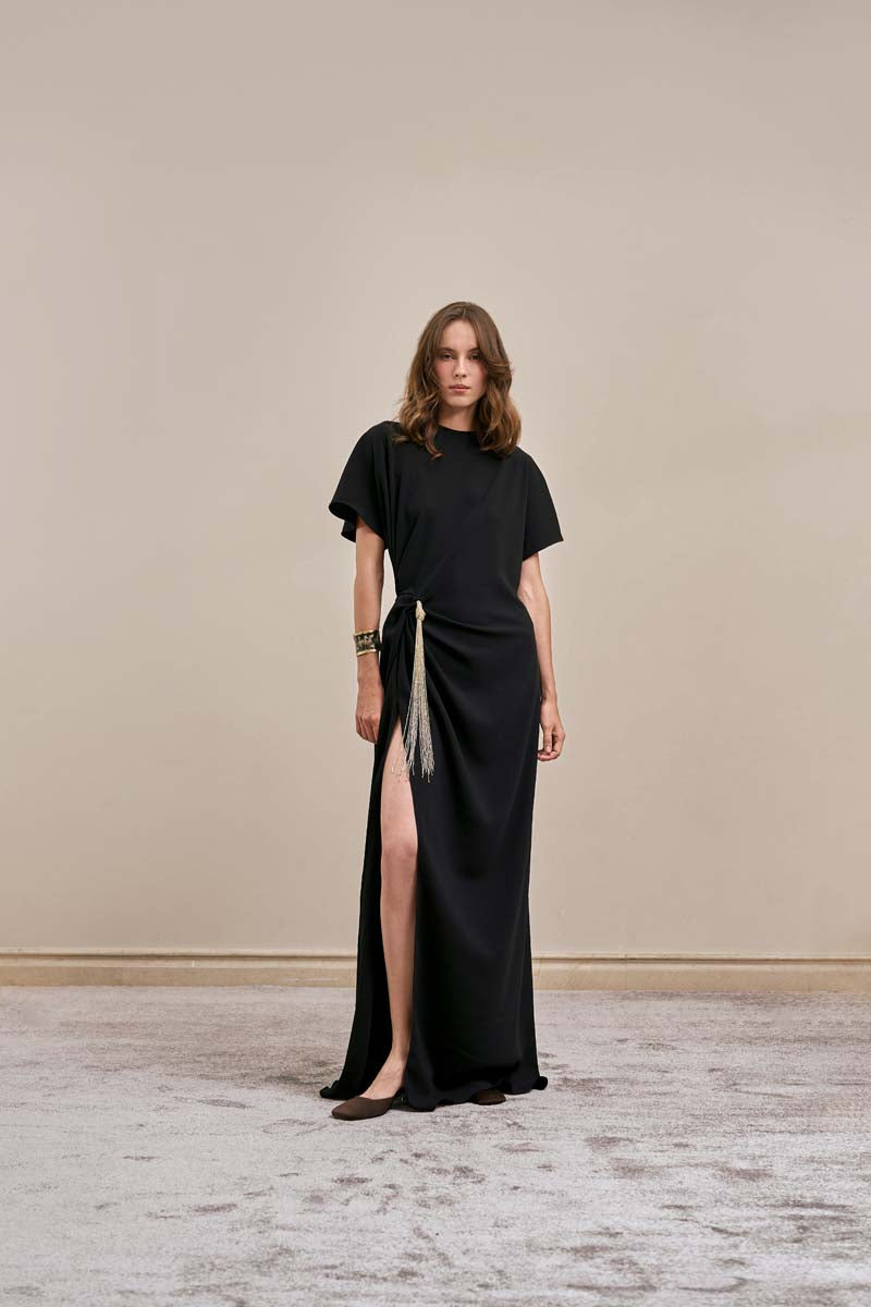 Black EASE dress by YASSMIN SALEH, a stylish maxi dress with a flattering fit, shown from the front.