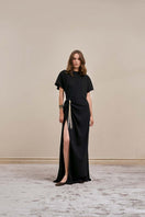 Black YASSMIN SALEH Ease maxi dress shown from the front, featuring a sleek, flowing design perfect for elegant occasions.
