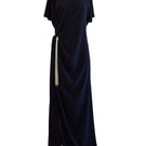 Black YASSMIN SALEH Ease Maxi Dress with ghost-back design, flowing fabric, and elegant style perfect for formal or casual wear.