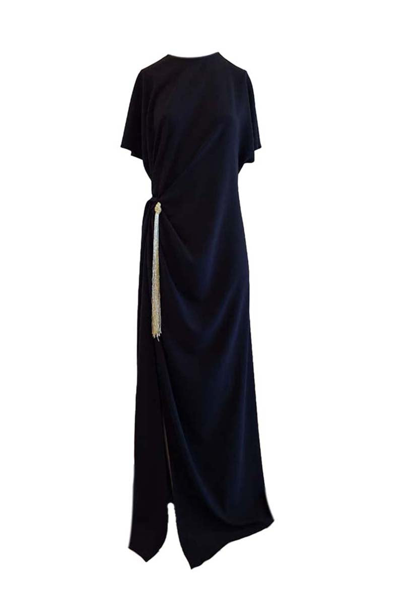 Black YASSMIN SALEH Ease maxi dress with ghost back design, flowing fabric, and elegant silhouette for stylish evening wear.