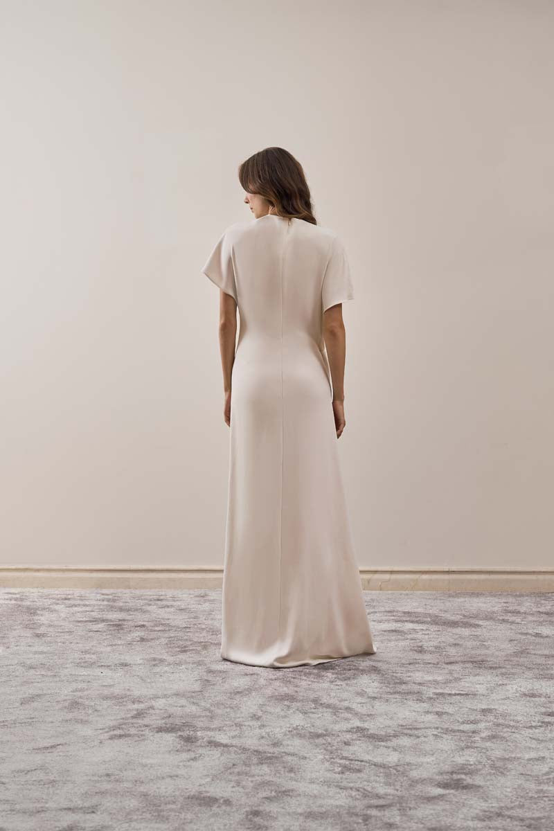 YASSMIN SALEH ivory maxi dress from the Ease Dress collection, back view showcasing flowing fabric and elegant design.