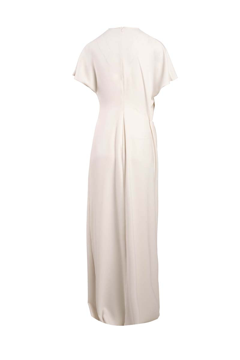 YASSMIN SALEH ivory maxi dress with ghost back design, flowing fabric, and elegant style for sophisticated occasions.