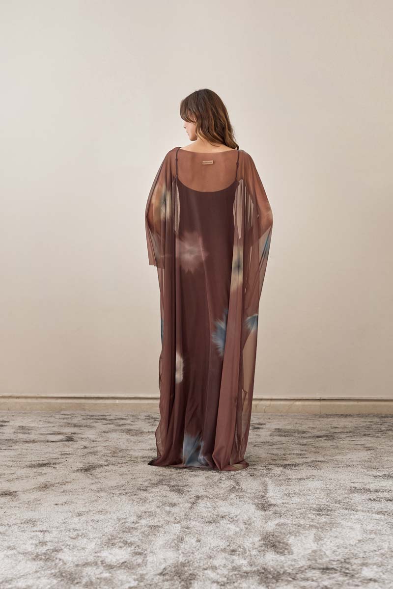 Brown YASSMIN SALEH Echo maxi dress shown from the back, flowing fabric and elegant design for stylish summer wear.