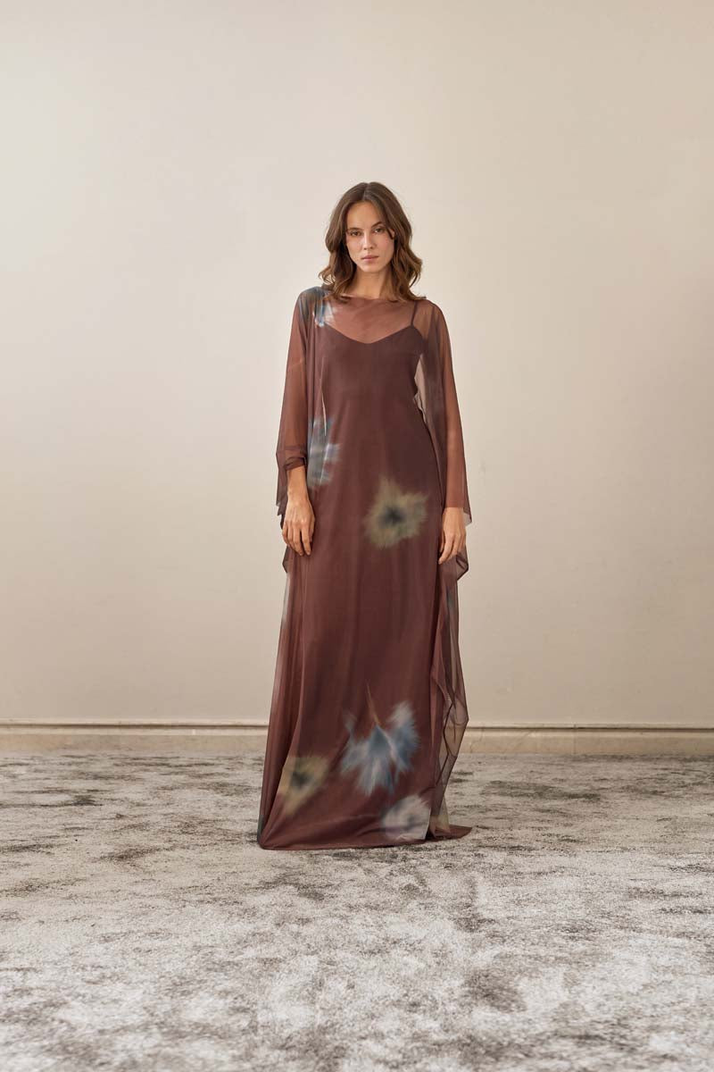 YASSMIN SALEH brown maxi dress with a flowing silhouette, front view showcasing elegant design and comfortable fabric.
