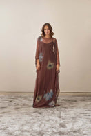 YASSMIN SALEH Echo brown maxi dress with a flowing silhouette, front view showcasing elegant design and fabric details.