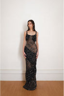 Black Echo gown by Yassmin Saleh featuring a flowing design, long sleeves, and elegant silhouette in a front view.