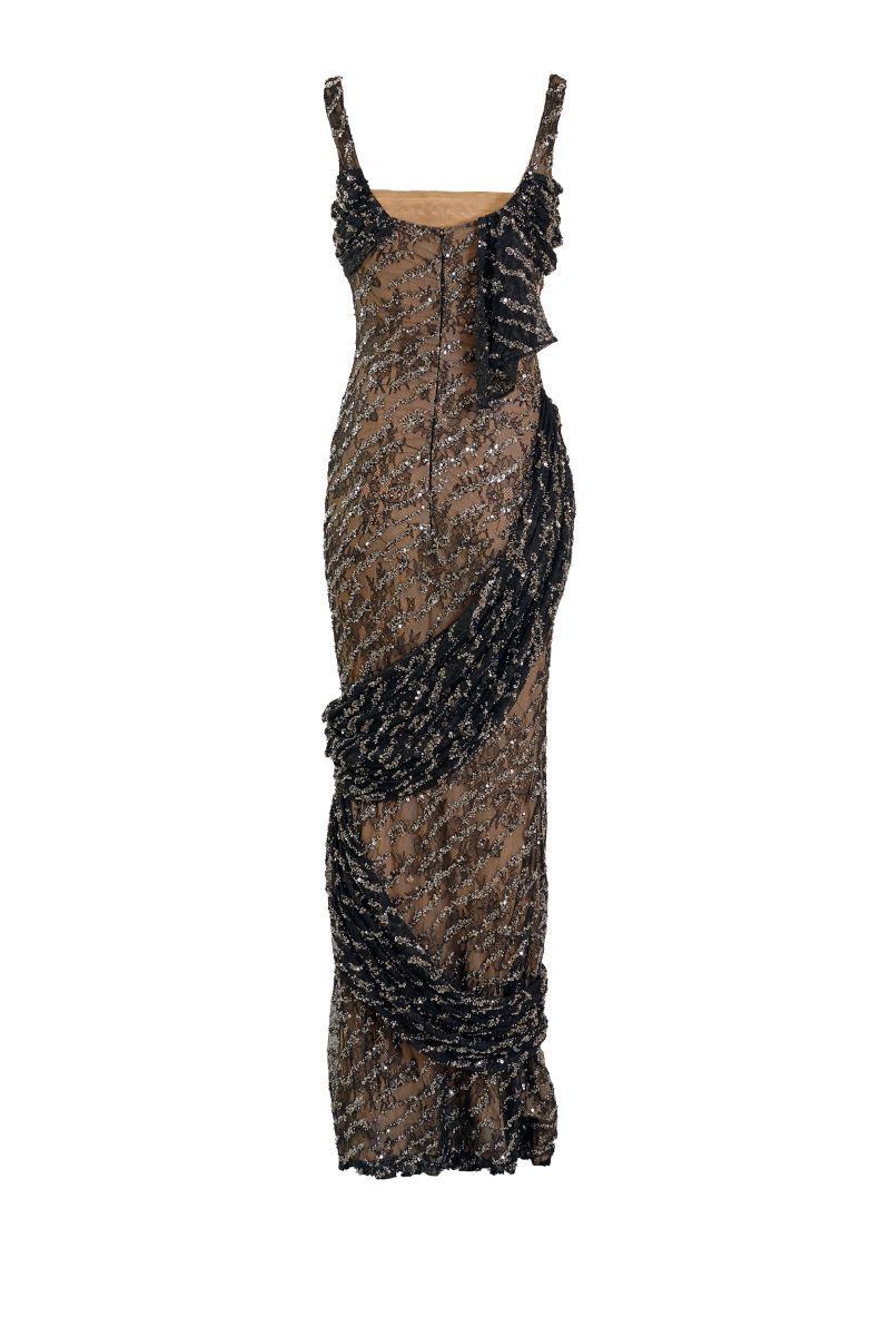 Black Echo gown by Yassmin Saleh featuring a flowing silhouette and ghost-back design for elegant evening wear.