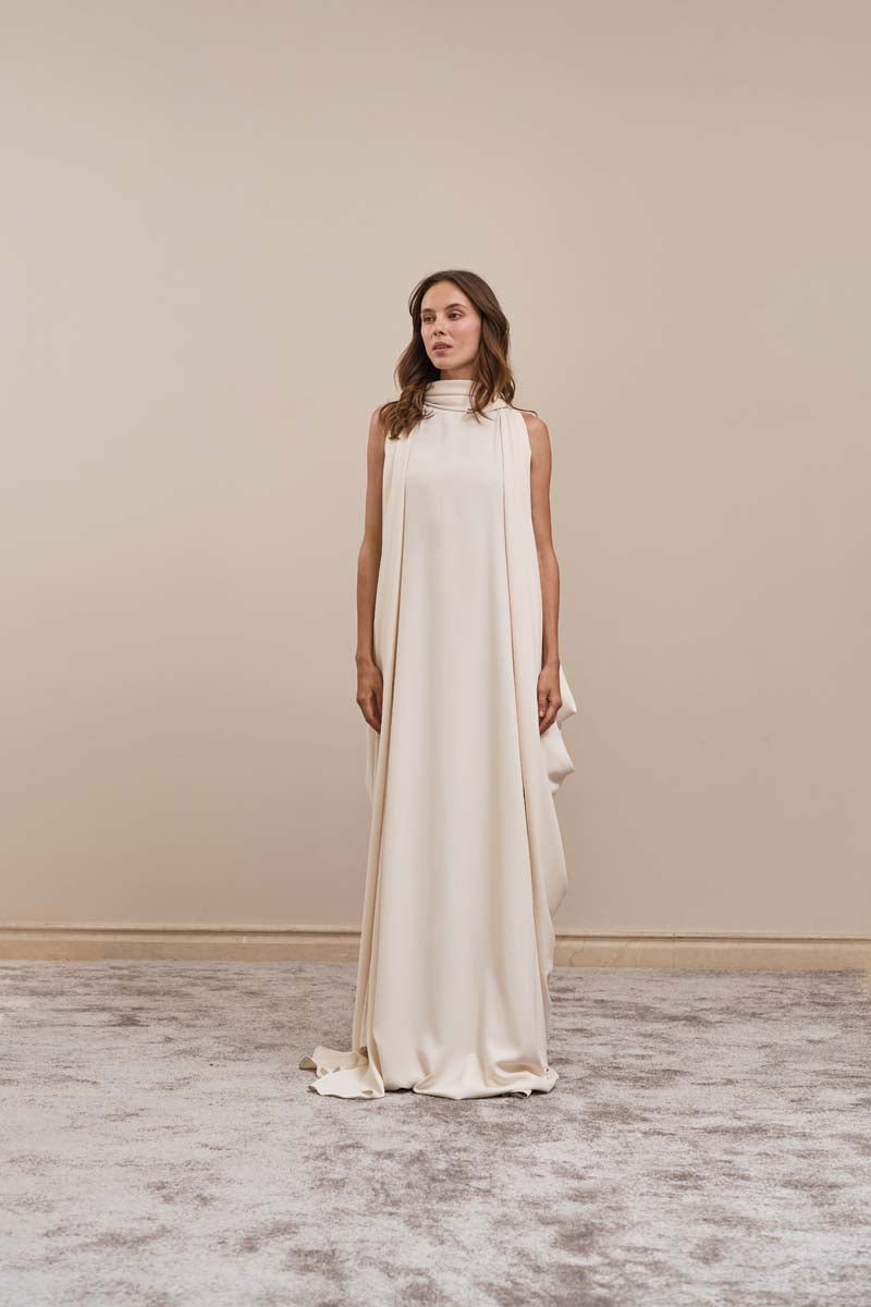 Ivory Eclipse Gown maxi dress by Yassmin Saleh featuring a flowing silhouette and elegant design, front view image.