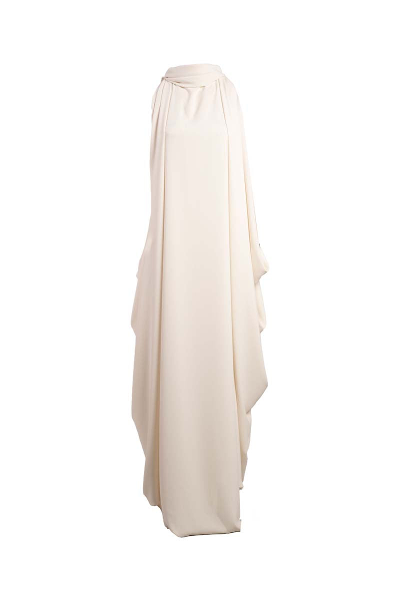 Ivory Eclipse Gown maxi dress by Yassmin Saleh with ghost back design, flowing fabric, and elegant silhouette.