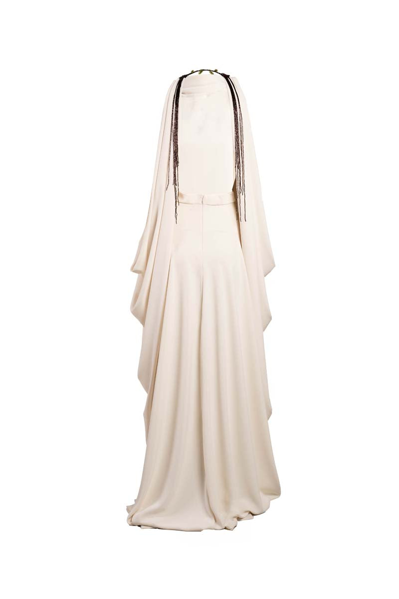Ivory Eclipse Gown by YASSMIN SALEH, elegant maxi dress with flowing fabric and ghostly front design, perfect for formal occasions.