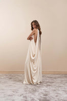Ivory YASSMIN SALEH Eclipse Maxi Gown showing side view with flowing fabric and elegant design.