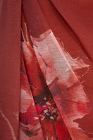 EEGEN STUDIO AZARA Maxi Dress with flowing fabric and elegant design, displayed on a hanger in a well-lit setting.