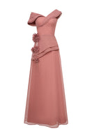 Elegant navy blue Cyra gown by EeGen Studio, featuring flowing fabric and intricate detailing, perfect for formal occasions.