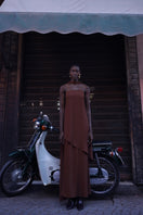 Chocolate brown Baobab maxi dress with flowing fabric and sleeveless design, elegant and perfect for summer occasions.