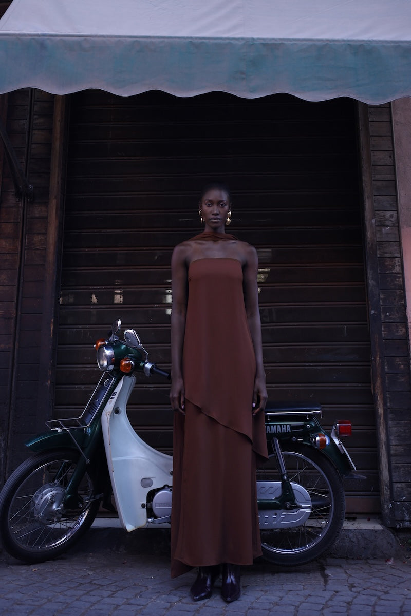 Chocolate brown Baobab maxi dress with flowing fabric and sleeveless design, elegant and perfect for summer occasions.