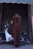 Baobab chocolate maxi dress featuring flowing fabric and a stylish design, perfect for elegant occasions.