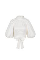 Ivory Elara crop top by ANA + MARIA displayed on a mannequin, showcasing a stylish, fitted tops design with a soft, smooth fabric.