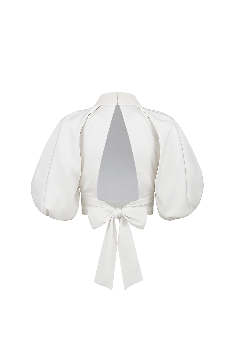 Light ivory Elara crop top by ANA + MARIA, shown on a ghost mannequin, highlighting its fitted design and soft fabric.