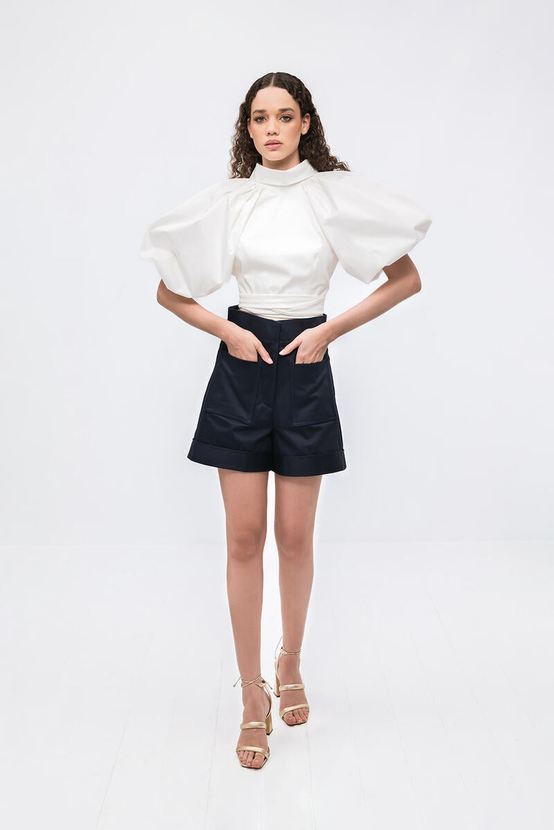 Ivory Elara crop top by ANA + MARIA, featuring a stylish and fitted design, shown on a neutral background.