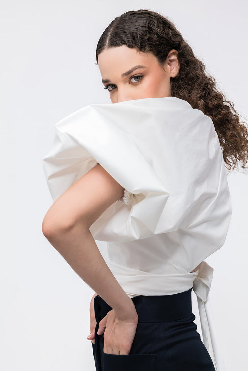 Ivory Elara crop top by ANA + MARIA, featuring a stylish, fitted design with soft fabric and short sleeves.