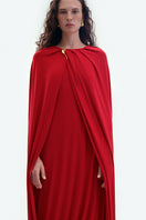 Red jersey midi cape dress by ElenaReva, featuring a flowing design and stylish cape detail, perfect for elegant occasions.
