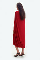Red jersey midi cape dress by ElenaReva, featuring flowing fabric and elegant design perfect for stylish occasions.