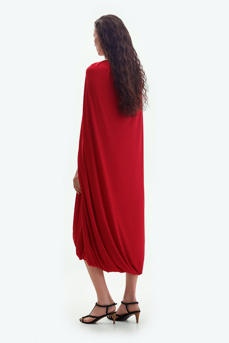 Red jersey midi cape dress by ElenaReva, featuring flowing fabric and elegant design perfect for stylish occasions.