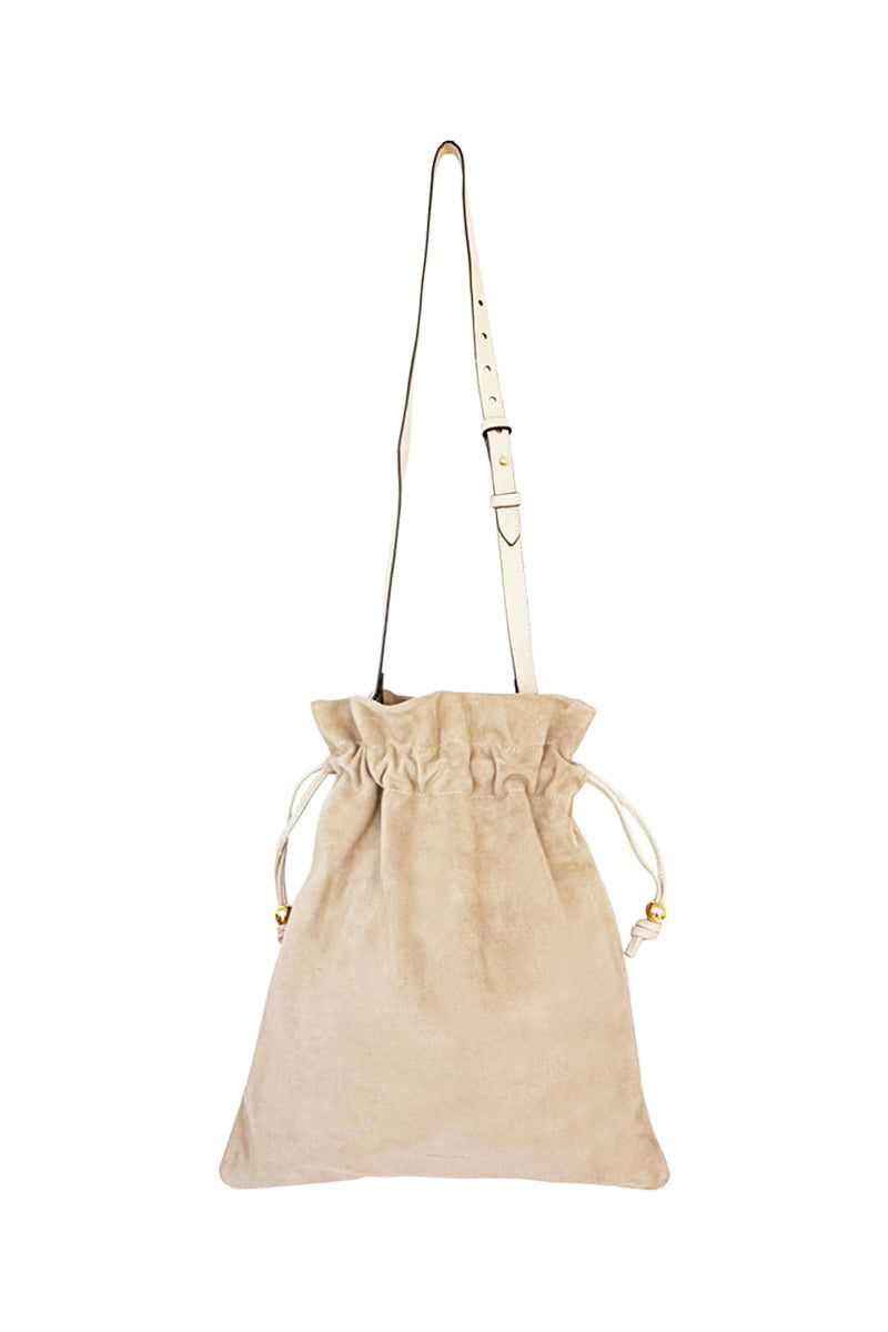 ISIDORA MALVA Elena suede pouch in nude with top handle, showcasing a sleek, soft leather design perfect for stylish carry.