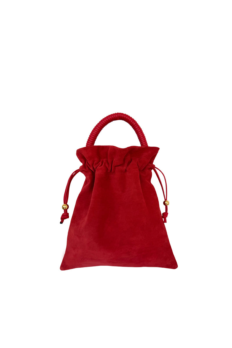Red suede Elena pouch by ISIDORA MALVA featuring a top handle bag design with a sleek, stylish look.