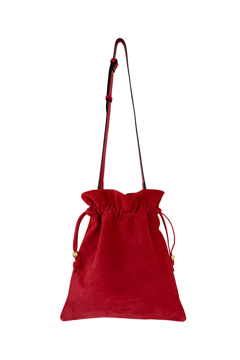 Red suede top handle pouch by ISIDORA MALVA featuring a compact, stylish design with a top handle and sleek finish.