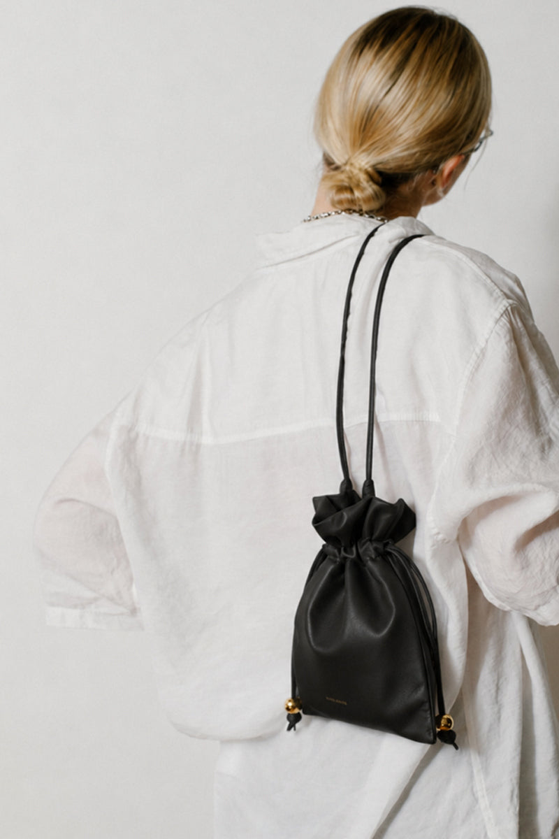 Black ISIDORA MALVA Elena Mini Pouch shoulder bag with compact design and sleek style, perfect for everyday use.