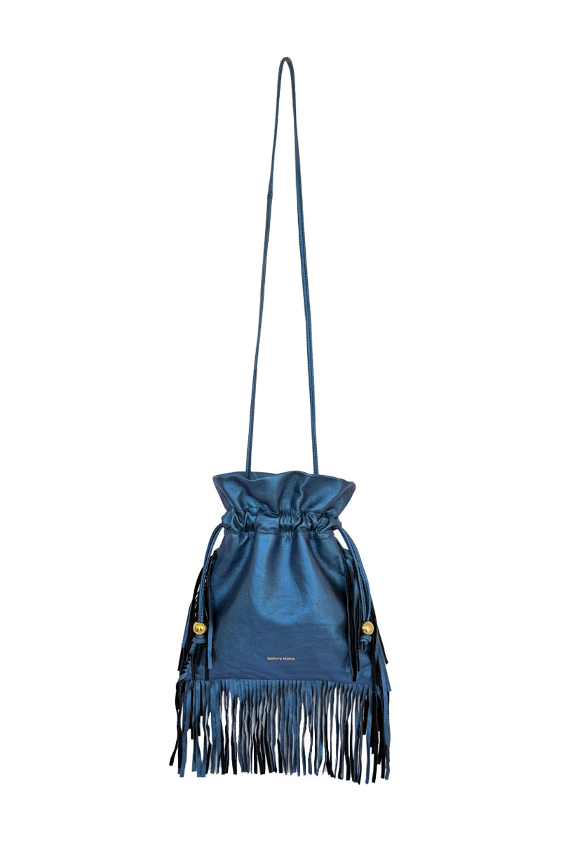 Electric blue ISIDORA MALVA Elena mini shoulder bag with fringe detailing on a plain background.